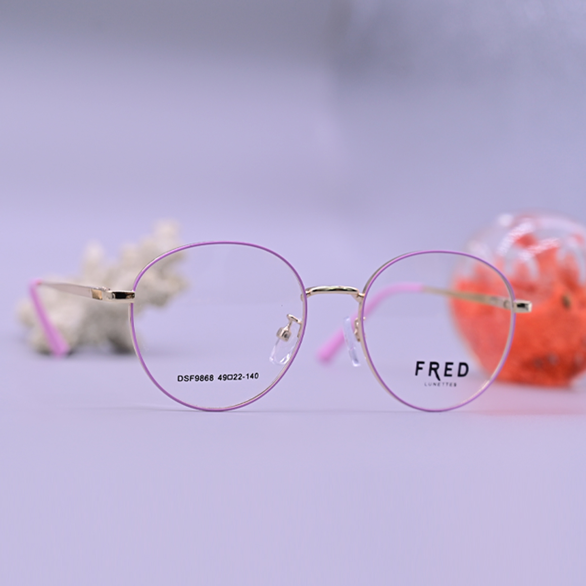 نظارة فريد طبية موديل 9868 بإطار معدني نحيف بلون وردي وتصميم دائري أنثوي من متجر عين العون.